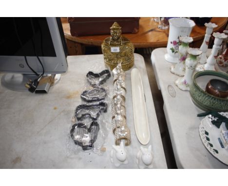 A collection of napkins rings in the form of rabbits; a Saddler tea caddy; an olive dish etc