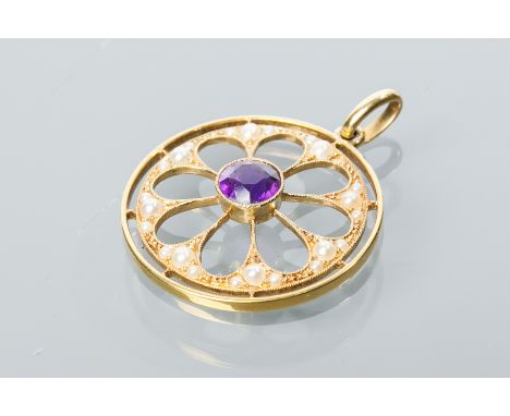 EDWARDIAN AMETHYST AND SEED PEARL PENDANT
of pierced circular form, with a central round amethyst surrounded by split pearls,