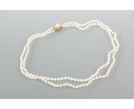DOUBLE STRAND PEARL NECKLACE
with pearl set fourteen carat gold clasp, the pearls 4.2mm diameter, 43cm long