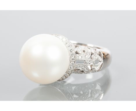 IMPRESSIVE SOUTH SEA PEARL AND DIAMOND DRESS RING
the large spherical pearl measuring approximately 15.5mm diameter, in a pie