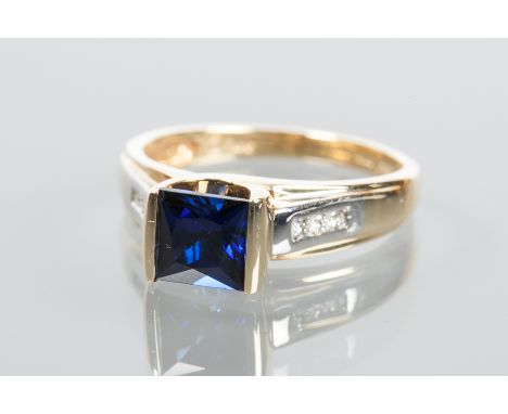 SAPPHIRE AND DIAMOND RING
with a central square sapphire on diamond set shoulders, in fourteen carat gold, size M-N