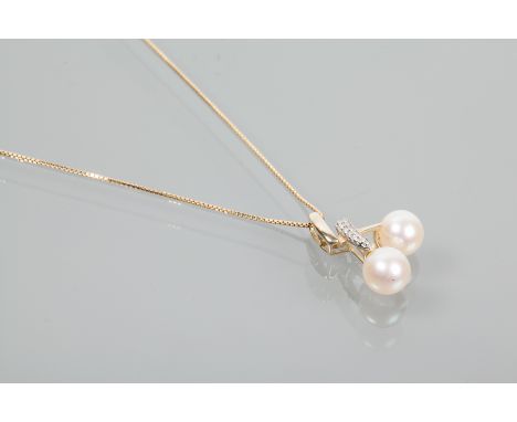 PEARL AND DIAMOND PENDANT ON CHAIN
set with two spherical white cultured pearls approximately 6.5mm diameter, the setting wit