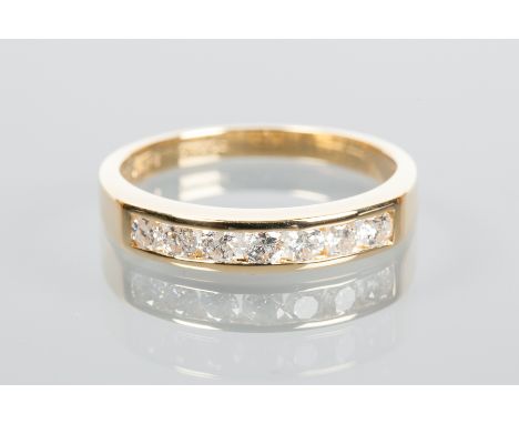 DIAMOND HALF ETERNITY RING
channel set with brilliant cut diamonds, in eighteen carat gold, size P