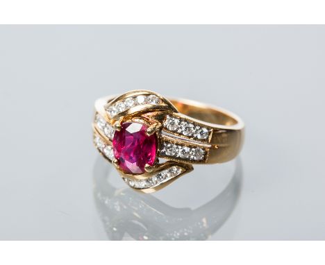 RUBY AND DIAMOND CLUSTER RING
the central oval ruby measuring approximately 6.78mm x 5.65mm, on diamond set bifurcated should