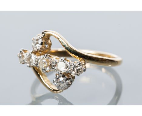 UNUSUAL DIAMOND SEVEN STONE RING
set with a graduated row of old cut diamonds, with two further old cut diamonds to either si