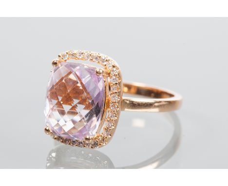 KUNZITE AND DIAMOND CLUSTER RING
the central faceted kunzite measuring approximately 11mm x 9mm, surrounded by a row of brill