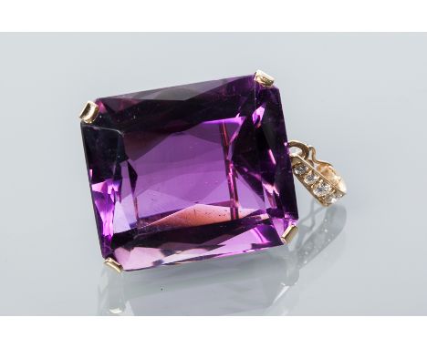 IMPRESSIVE AMETHYST AND DIAMOND PENDANT
the large step cut amethyst measuring approximately 31 x 27mm, below a graduated row 