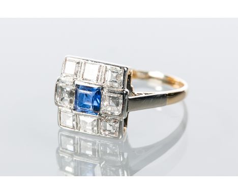 ART DECO SAPPHIRE AND DIAMOND CLUSTER RING
the central square step cut sapphire surrounded by a cluster of square cut diamond