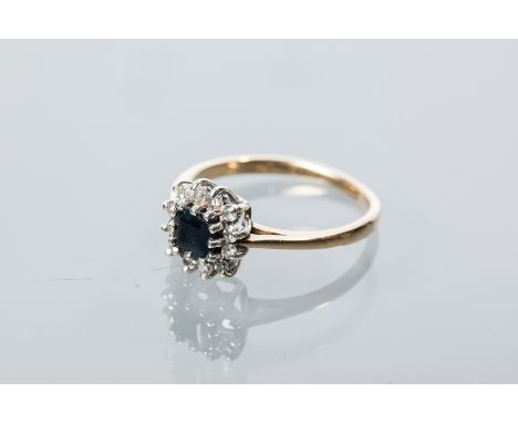 SAPPHIRE AND DIAMOND CLUSTER RING
with a central square sapphire surrounded by round diamonds, hallmarked for nine carat gold