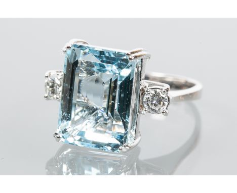 AQUAMARINE AND DIAMOND THREE STONE RING
the central emerald cut aquamarine approximately 9.71 carats, flanked by two brillian