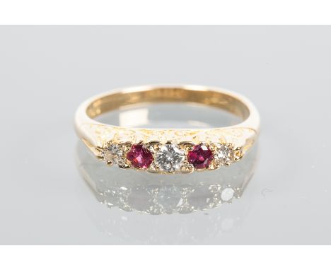 VICTORIAN STYLE RUBY AND DIAMOND FIVE STONE RING
set with alternating rubies and diamonds, in a scrolling design setting, hal