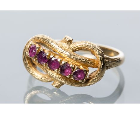 UNUSUAL VICTORIAN STYLE RUBY RING
with a row of round rubies in a knotted setting, unmarked, size O