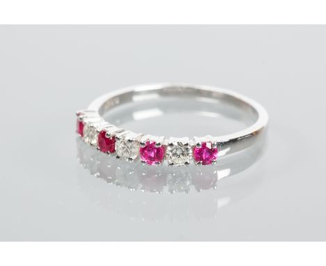 RUBY AND DIAMOND HALF ETERNITY RING
set with alternating rubies and diamonds, in nine carat white gold, size M-N