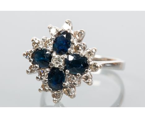 SAPPHIRE AND DIAMOND CLUSTER RING
set with four oval sapphires surrounded by brilliant cut diamonds, in eighteen carat white 