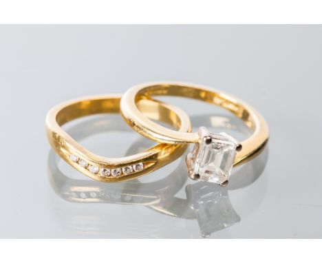 DIAMOND SOLITAIRE RING
the baguette cut diamond 0.63 carats, hallmarked eighteen carat yellow gold, size H; together with a d