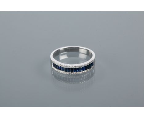 SAPPHIRE AND DIAMOND HALF ETERNITY RING
with a row of channel set baguette cut sapphires flanked by two rows of diamonds, mar