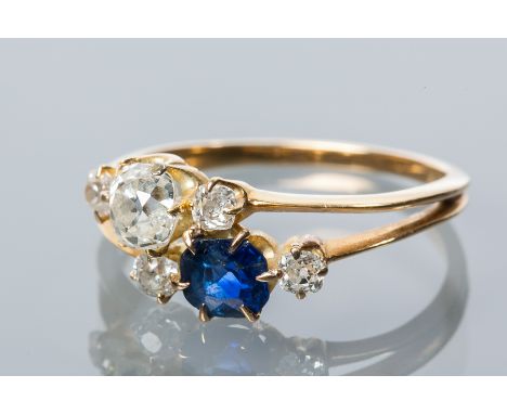 SAPPHIRE AND DIAMOND DRESS RING
the largest old cushion cut diamond approximately 0.50 carats, the cushion cut sapphire also 