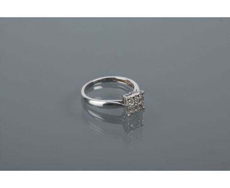 SQUARE BEZEL DIAMOND CLUSTER RING
set with nine brilliant diamonds, hallmarked nine carat white gold, size K