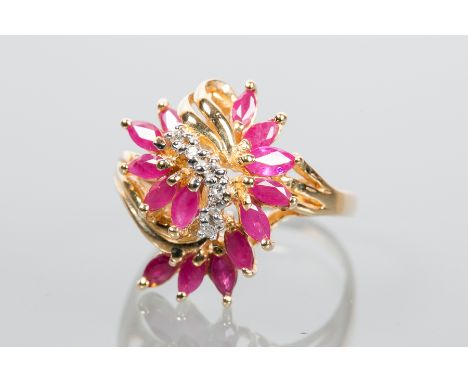 RUBY AND DIAMOND CLUSTER RING
of floral design,  with two curved rows of marquise cut rubies and a central row of diamonds, m