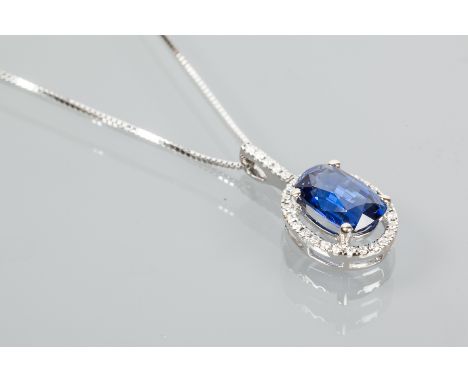 SAPPHIRE AND DIAMOND CLUSTER PENDANT
set with a cushion cut sapphire of approximately 4.69 carats, surrounded by 0.25 carats 