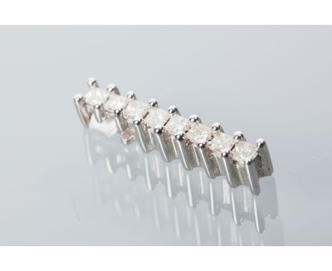 DIAMOND PENDANT
set with a vertical row of eight square step cut diamonds, in eighteen carat white gold