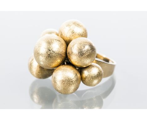 UNUSUAL FOURTEEN CARAT GOLD DRESS RING
the bezel set with gold graduated balls, marked 14 for fourteen carat yellow gold, siz