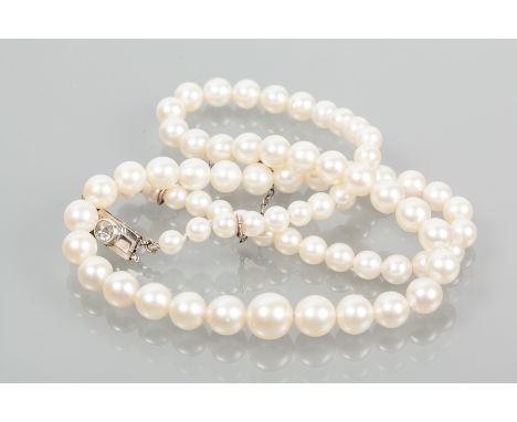 GRADUATED PEARL NECKLACE
the largest pearl 8mm diameter, the smallest pearl 4.1mm diameter, with a nine carat white gold rose