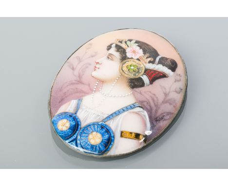 LIMOGES STYLE ENAMELLED PORTRAIT BROOCH
of oval form, depicting a woman with pearls wearing blue in profile, signed L. Mulor,