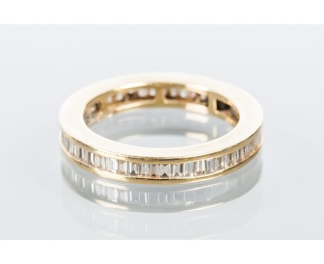 DIAMOND SET FULL ETERNITY RING
with channel set baguette cut diamonds, marked 750 for eighteen carat gold, size M-N