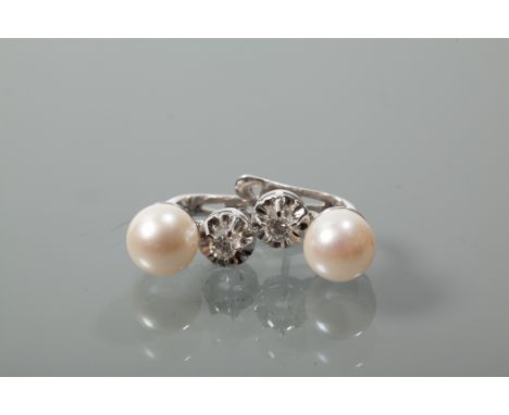 PAIR OF PEARL AND DIAMOND EARRINGS
each with a spherical pearl measuring approximately 8.4mm diameter, below a diamond measur