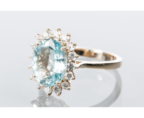 AQUAMARINE AND DIAMOND CLUSTER RING
with a central oval aquamarine of approximately 3.02 carats, surrounded by brilliant cut 