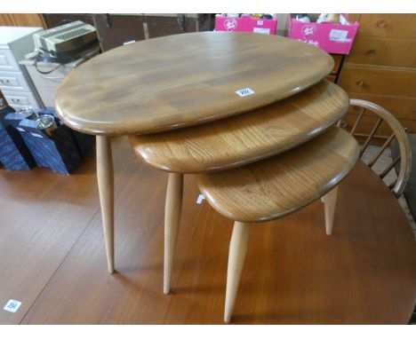 A nest of three Ercol light elm pebble coffee tables 