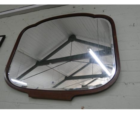 A shaped wall mirror in inlaid mahogany frame 