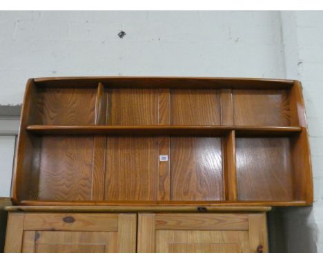 An Ercol elm wall shelf fitting