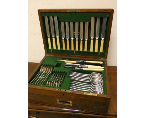 A canteen of Elkington plated cutlery for six people in oak cabinet case, one ladle missing 