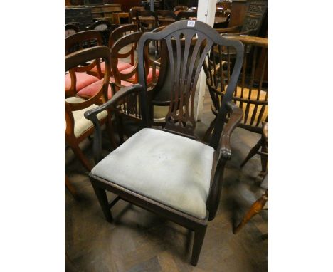 A Georgian style mahogany elbow chair with green upholstered seat 