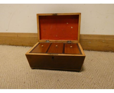 A Georgian mahogany three division tea caddy with brass handles 