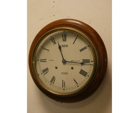 A circular wall clock in mahogany case, face 12" diameter