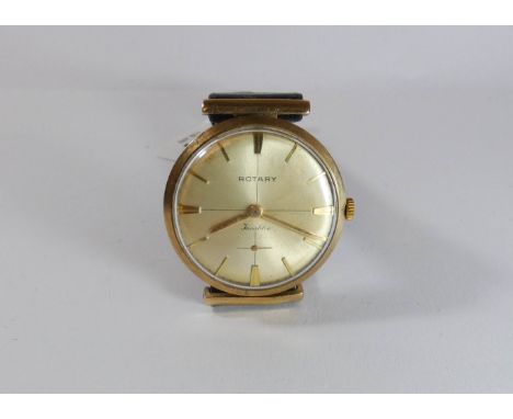 Gent's vintage 9ct gold Rotary wristwatch on a brown leather strap, circular dial with baton numerals and hooded lugs  watch 