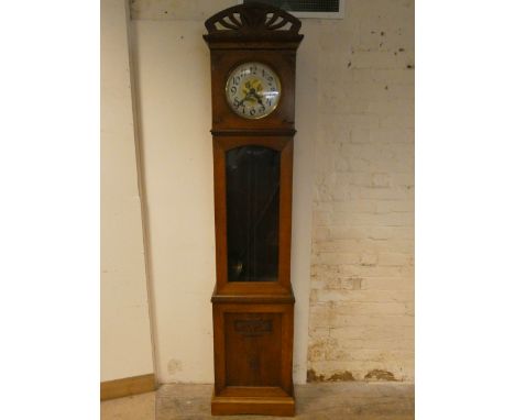 A 1930's oak long case clock with glazed door, circular brass and silvered dial, 10" diameter 