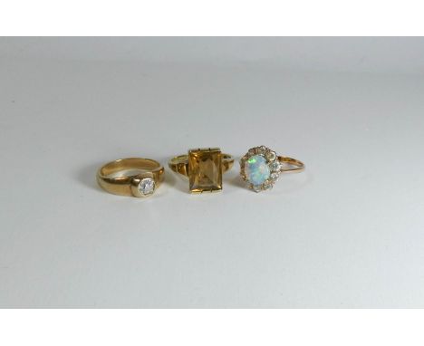 Three 9ct gold rings to include diamond signet ring and an opal cluster 