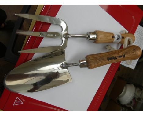 A stainless steel garden trowel and fork 