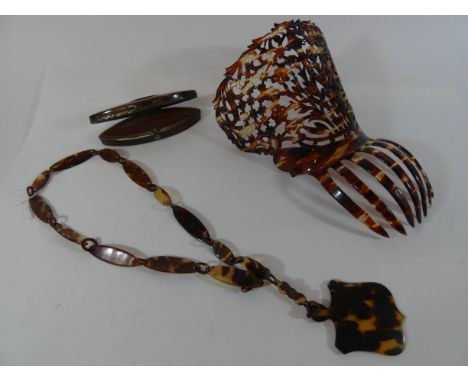 A large faux tortoiseshell hair comb, pendent and a snuff box 