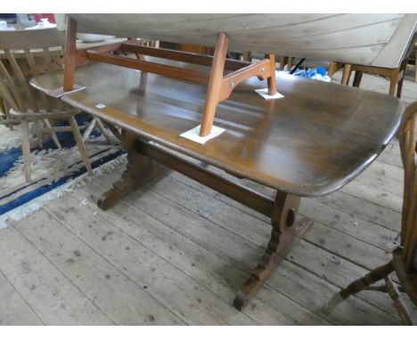 An Ercol oak refectory dining table 5' x 2'6 