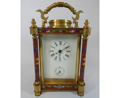 A large brass and cloisonne cased repeater carriage clock, height with handle up 22cms tall 