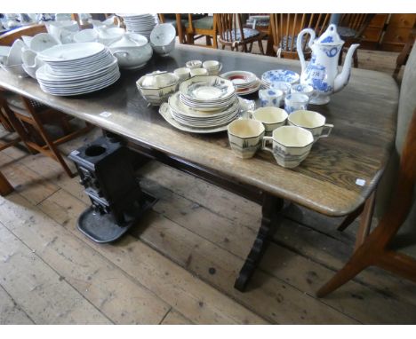 An Ercol oak refectory style dining table 5' x 2'6 