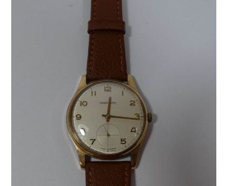 Gent's vintage Garrard wristwatch in 9ct gold case on brown leather strap  Watch running at time of inspection