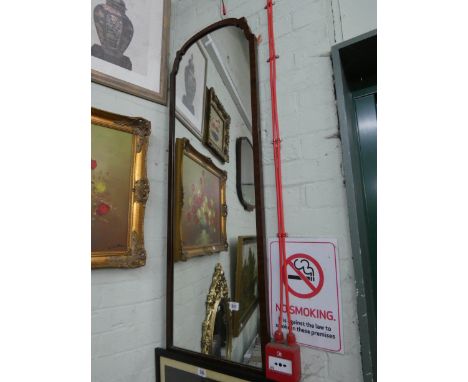 A long wall mirror in walnut frame 