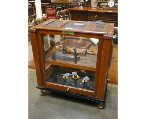 A set of Stanton Laboratory scales in glazed mahogany cabinet 