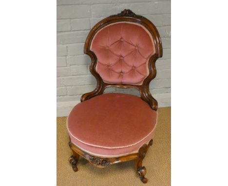 A pretty Victorian walnut framed occasional chair on cabriole legs with ink buttoned back and upholstered sprung seat 